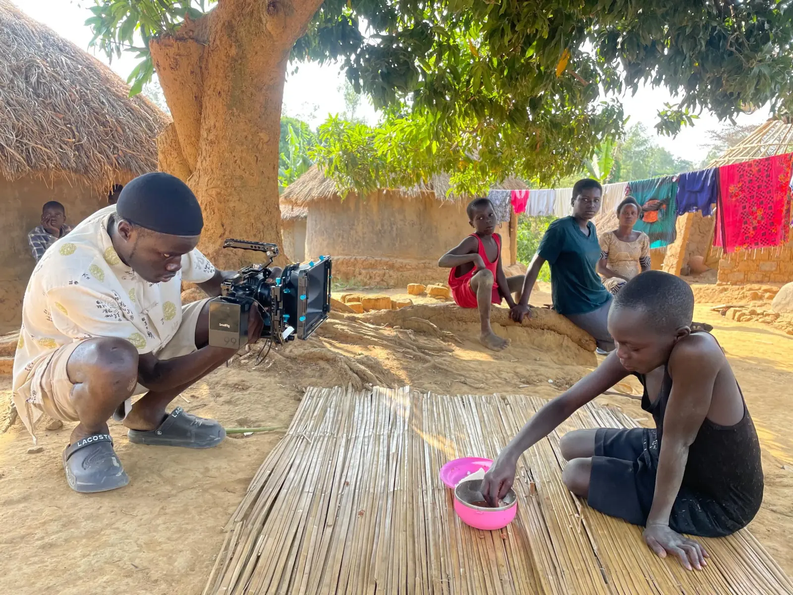 A NUFA cinematographer filming on location